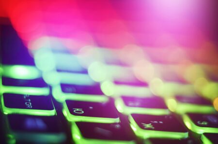 Laptop keyboard with blue backlight. Buttons closeupの写真素材