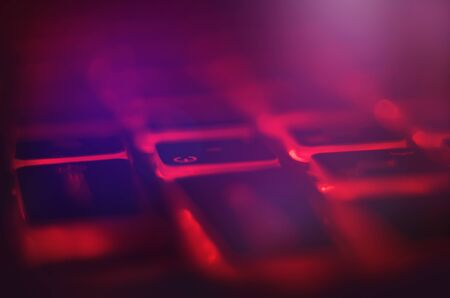 Laptop keyboard with red backlight. Buttons closeup.の写真素材