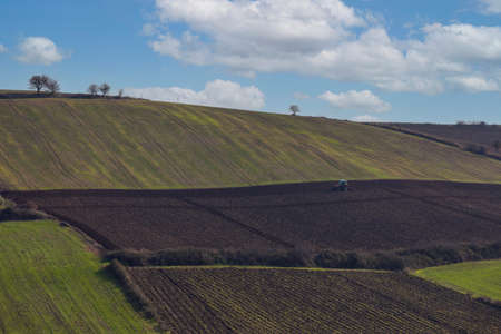 Aerial view of rolling hills in the countryside in springtime.