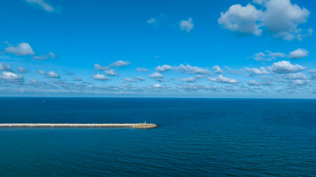 Aerial view of the sea and blue sky with white clouds.の写真素材