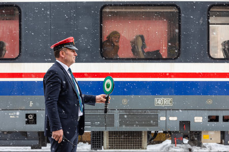 Erzincan, Turkey- January 26, 2022: it's snowing, train and passengers.