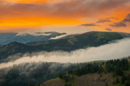 Beautiful mountain landscape with clouds at sunrise.の写真素材