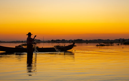 Fisherman on the Inle lake at sunset, Myanmar.の写真素材