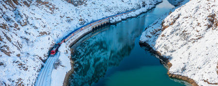 Ankara-Kars (Diesel Train) Eastern Express train in rainy day, Erzincan, Turkey. The travel of Eastern Express takes 24 hours between Ankara and Kars.の写真素材
