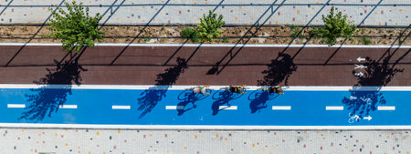 Aerial view of cycling race track with bicycle lane and people silhouettesの写真素材