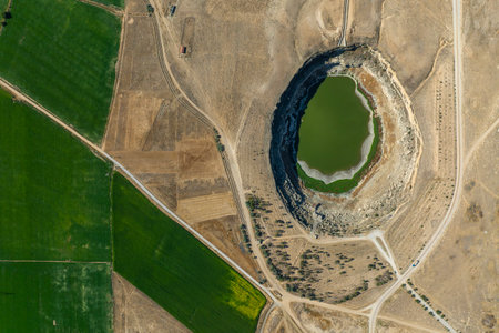 Aerial view of the lake in the middle of the field.の写真素材