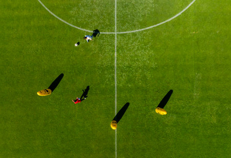 Aerial view of a soccer field with players in the corner.の写真素材