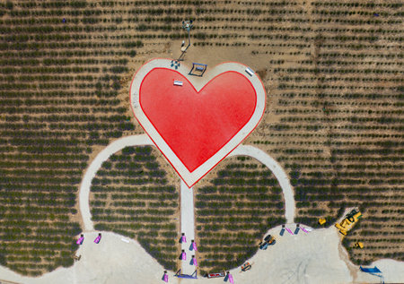 Aerial view of a heart shape on a road in the countrysideの写真素材