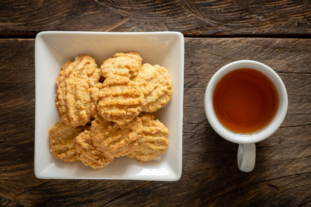 Cereal cookies and cup of tea on top view.の写真素材