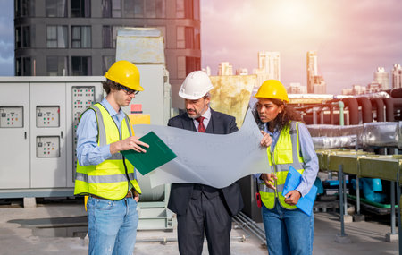 Engineer and businesswoman discussing on construction site. Engineering and architecture concept.