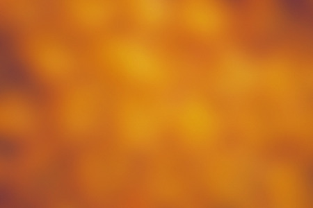 abstract blur background.blurred shade of red and orange tangerine color wallpaper concept.Christmas...