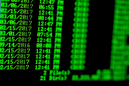 Hacker concept. Windows computer list of files in directory.Green text on black background.の写真素材