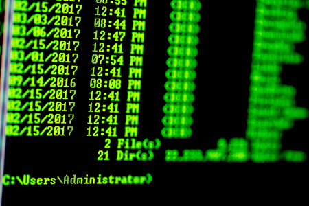 Hacker concept. Windows computer list of files in directory.Green text on black background.の写真素材