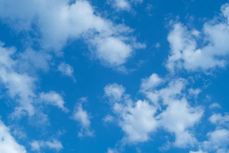 White heap clouds in the blue sky at the summer day.の写真素材