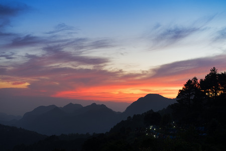 Amazing sunset.Natural Sunset Sunrise Over Mountain. Bright Dramatic Sky And Dark Ground.Colorful sky in the sunset.の写真素材