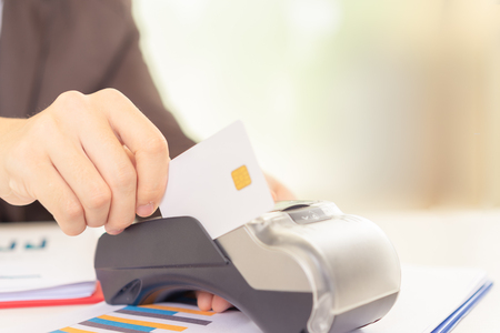 Hands are using Electronic Data Capture machine (EDC) or credit card terminal for make a payment.の写真素材