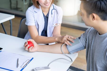 Professional doctor consulting, diagnostic examination on men's health disease at clinic or hospital officeの写真素材