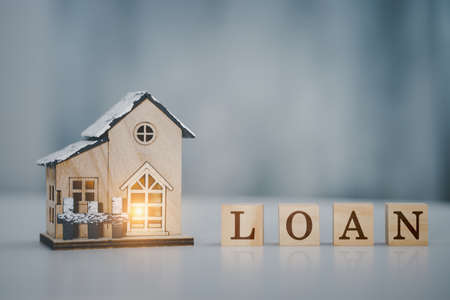 Close up of model house and home loan letter. Real estate , home loan and investments concept.
