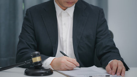 Judge or Lawyer signing legal document. Sign a contract business concept.の写真素材