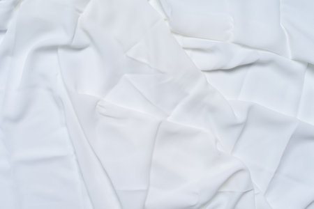 White wrinkled, rippled, surface fabric texture background.の写真素材