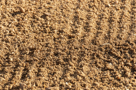 A close up of newly raked sand in a kids play areaの写真素材