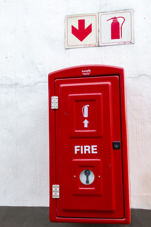A Close up view of a red fire extinguishes box incase of a fireの写真素材