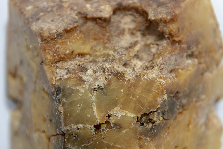 A close up view of natural parmasan cheese on a isolated white backgroundの写真素材