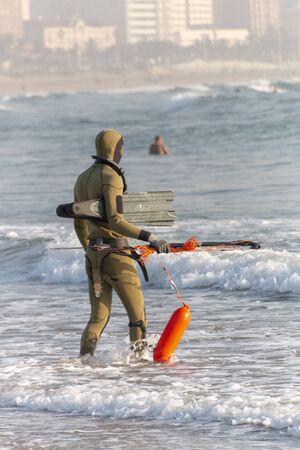 A close up view of a scrubber diver waiting to enter the oceanの写真素材