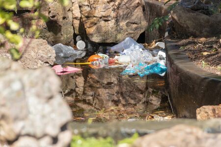 A close up view of rubbish in a outdoor pondの写真素材