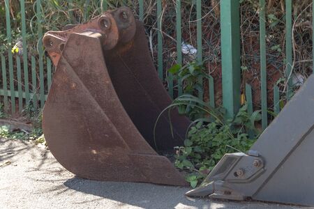 A close up view of a rusted old metal tractor armの写真素材