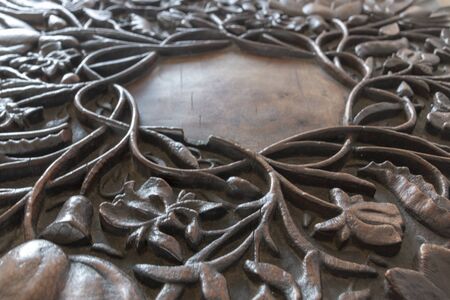 A close up view of a beautiful antique wooden carved table