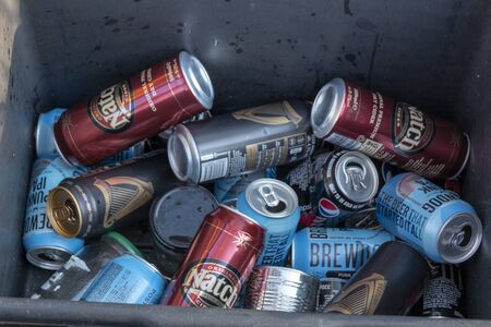 Bristol-March 2020-England-a close up view of tin's of alcohol  in a waste recycling box の写真素材