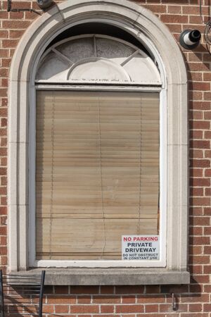 a close up view of a bay window with the shutters closedの写真素材