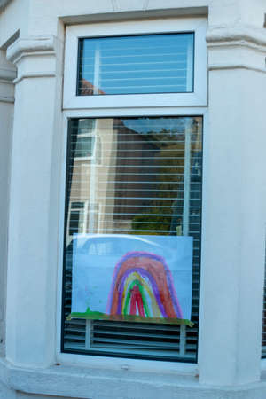 Bristol-March 2020-England-a close up view of rainbows that children and drawn and put up into thier windows to show hope for this time of lockdown during the C19 virus outbreakのeditorial素材
