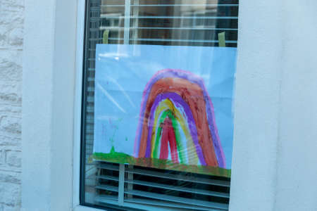 Bristol-March 2020-England-a close up view of rainbows that children and drawn and put up into thier windows to show hope for this time of lockdown during the C19 virus outbreakのeditorial素材