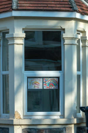 Bristol-March 2020-England-a close up view of rainbows that children and drawn and put up into thier windows to show hope for this time of lockdown during the C19 virus outbreakのeditorial素材