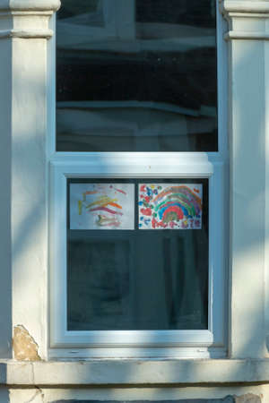 Bristol-March 2020-England-a close up view of rainbows that children and drawn and put up into thier windows to show hope for this time of lockdown during the C19 virus outbreakのeditorial素材