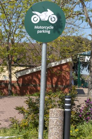 a sigh that shows a motocycle parking onlyの写真素材