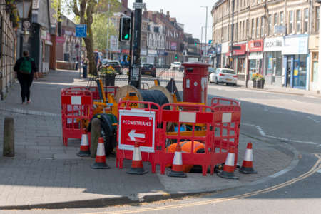 Bristol-April 2020-England- a close up view of construction workings fixing and replacing underground wiringのeditorial素材