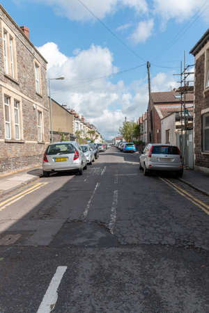 Bristol-April 2020-England- a close up view of a empty street with everyone in lockdown the road is full of cars in there parkingsのeditorial素材