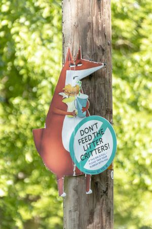 Bristol-May-2020-England-a close up view of a do not litter sign that is up on a light pole in a...