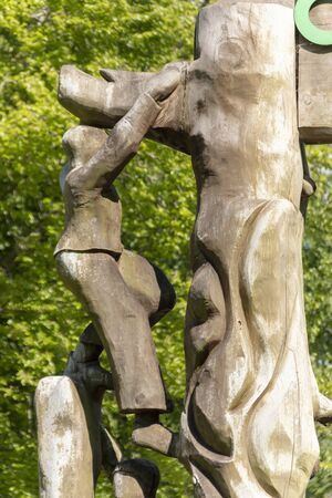 Bristol-May-2020-England-a close up view of a carved wooden structure outside a playarea of children playingの写真素材