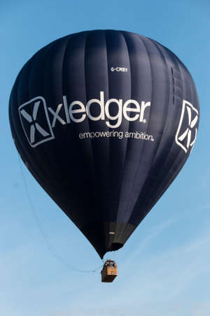 A close up of a hot air  ballon high in the skyの写真素材