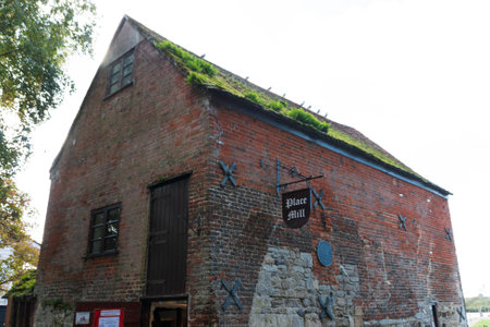 A close up view of a small building on the edge of the waterの写真素材