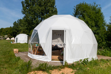 A close view of a glamping pod on a field on a farm.の写真素材