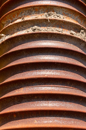 A close up view of rusted old coil.の写真素材
