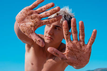 Summer and vacation. An attractive guy is resting at the sea.の写真素材
