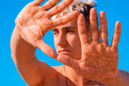 Summer and vacation. An attractive guy is resting at the sea.の写真素材