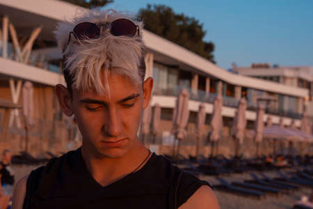 Young attractive guy on the pier.の写真素材