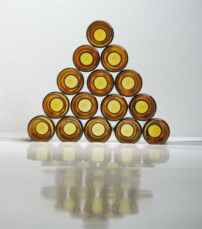 A pyramid brown glass bottle.の写真素材